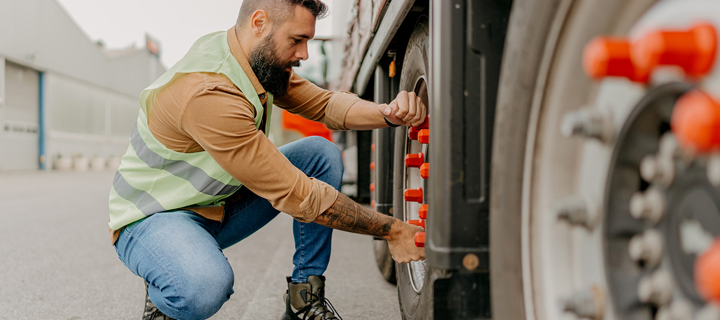 A photo of a DOT inspector conducting a roadside inspection