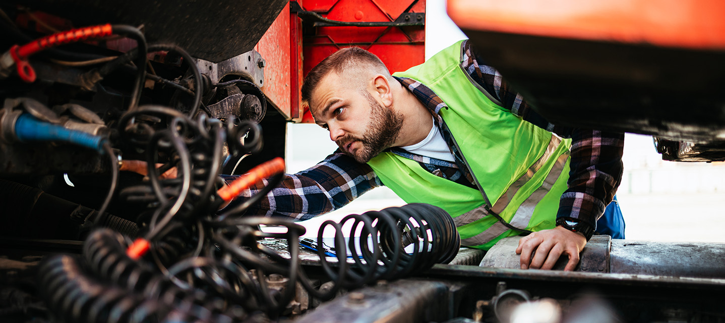 photo of a driver inspecting their truck.