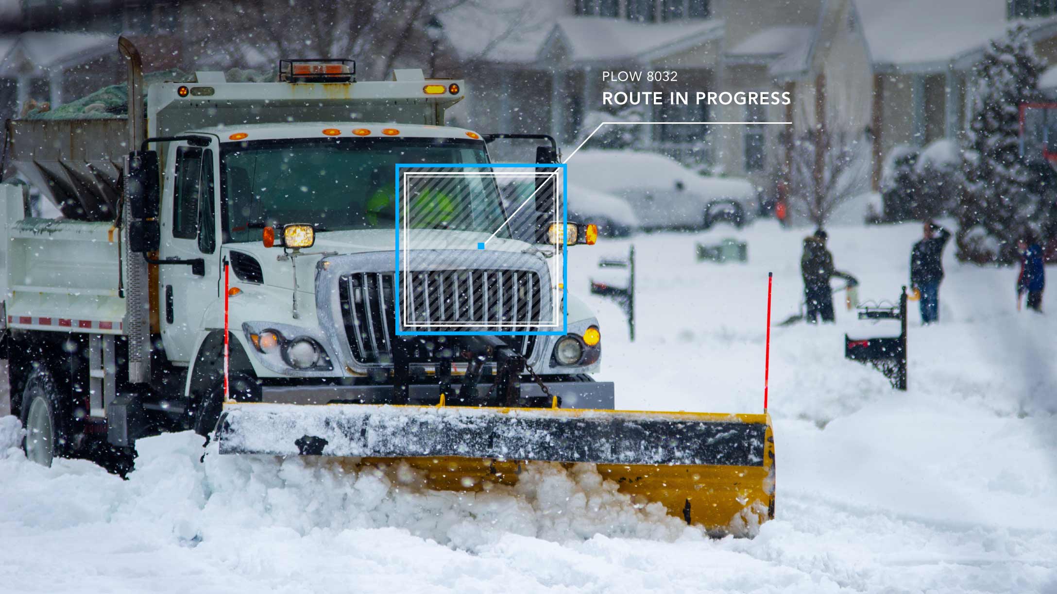 snow plow removing snow from the street