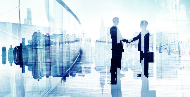 business individuals in suits shaking hands