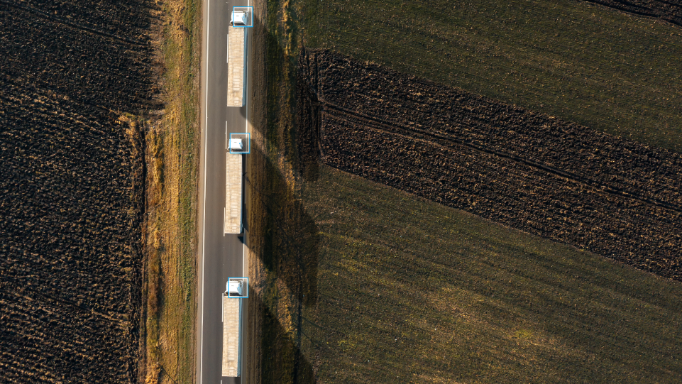 three vehicles with a blue square 