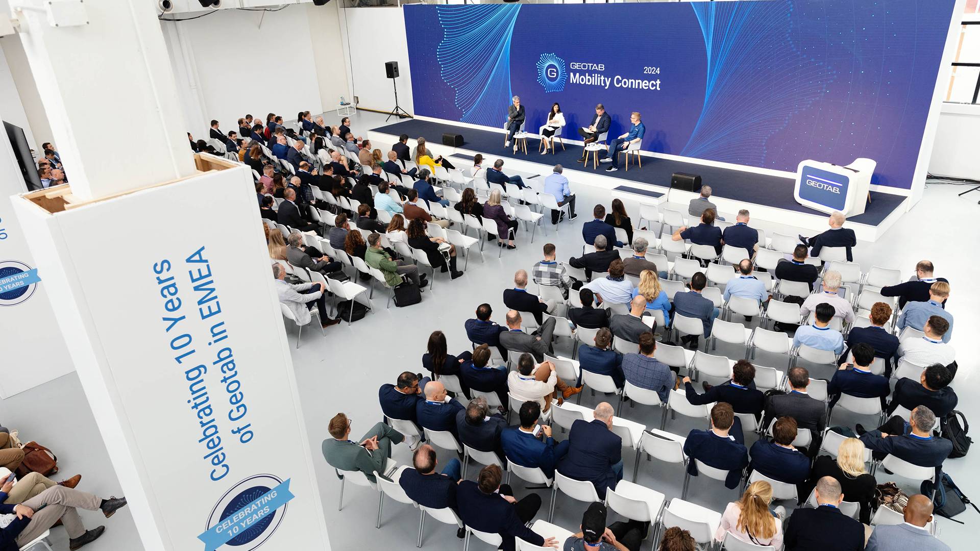 an audience listening to a panel