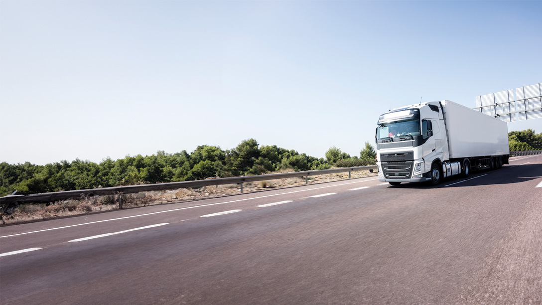 European transport truck on road with TUV Rheinland Certified test mark