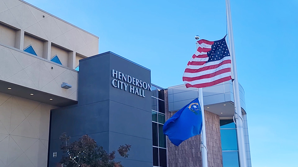 City of Henderson town hall with American flag in front of it