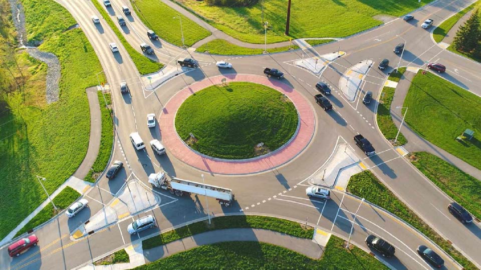 Aerial image of a roundabout with cars driving through it