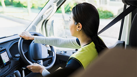 A female driver in a vehicle