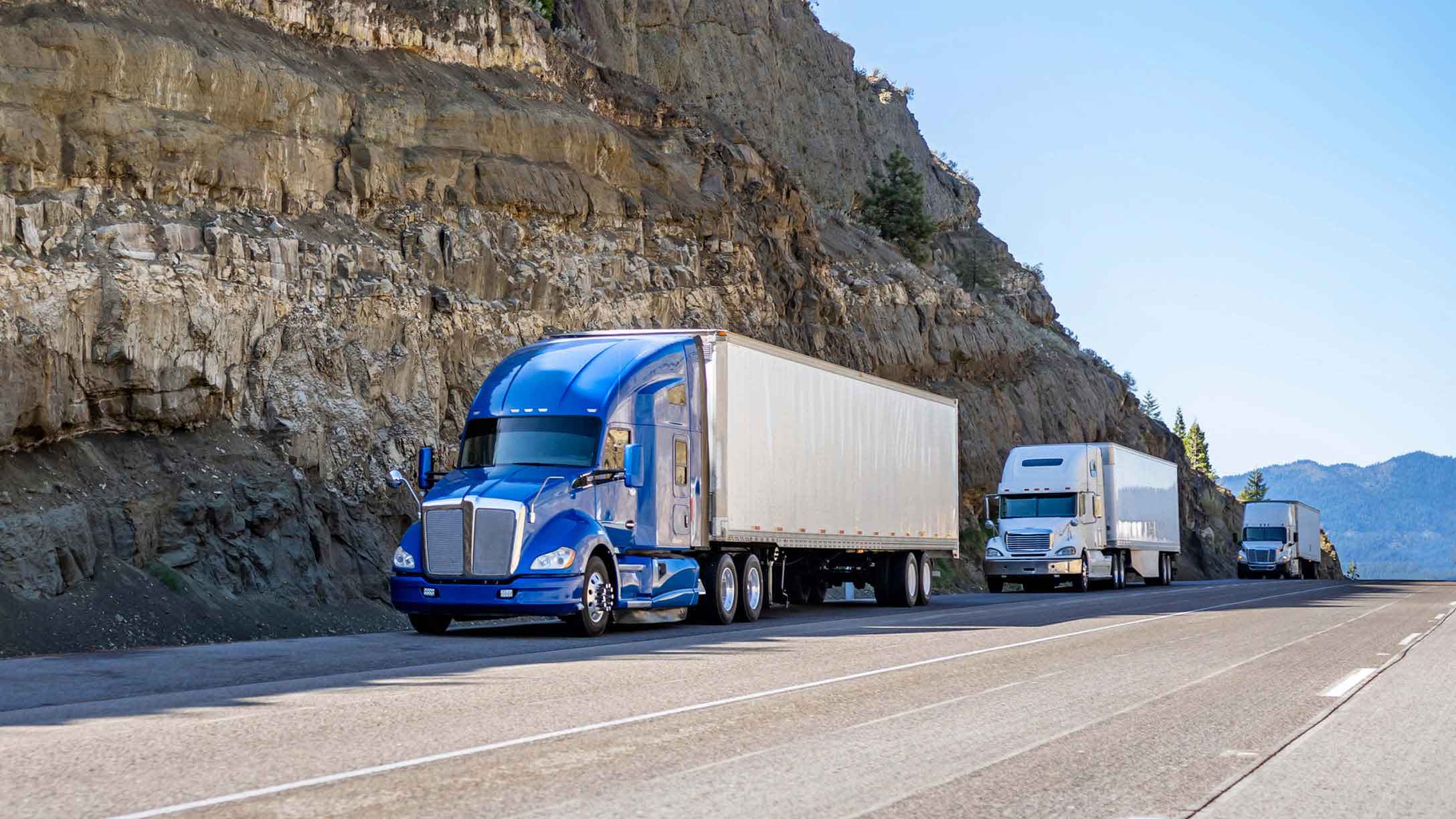 Two trucks driving on california interstate
